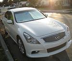 2011 G37 Sedan, 6MT moonlight white-passengersidefront.jpg