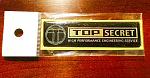 Brand New Sealed Top Secret Black / Gold emblem-image.jpeg