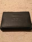 New unused Infiniti black leather OEM manual book cover-img_8255.jpg